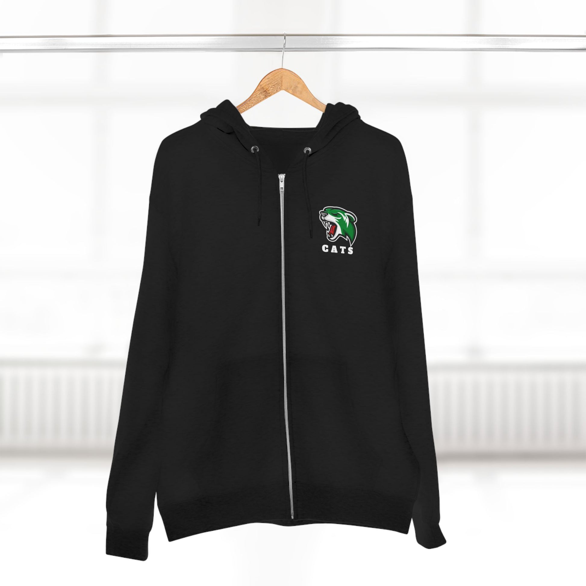 Black Noah Boucher Toronto Fisher Cats Zip Hoodie on wooden hanger. Blurry white room in background