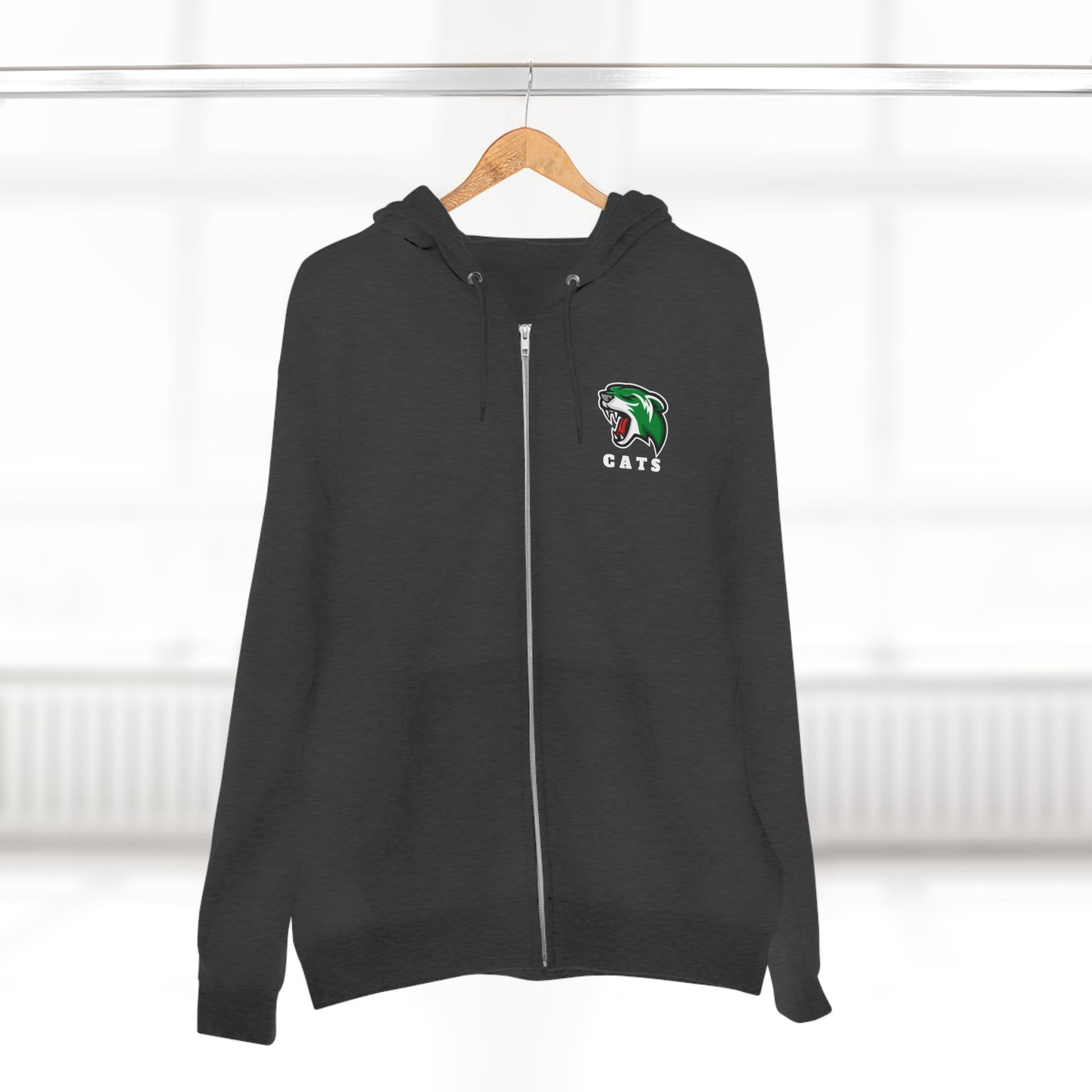Charcoal Grey Noah Boucher Toronto Fisher Cats Zip Hoodie on wooden hanger. Blurry white room in background.