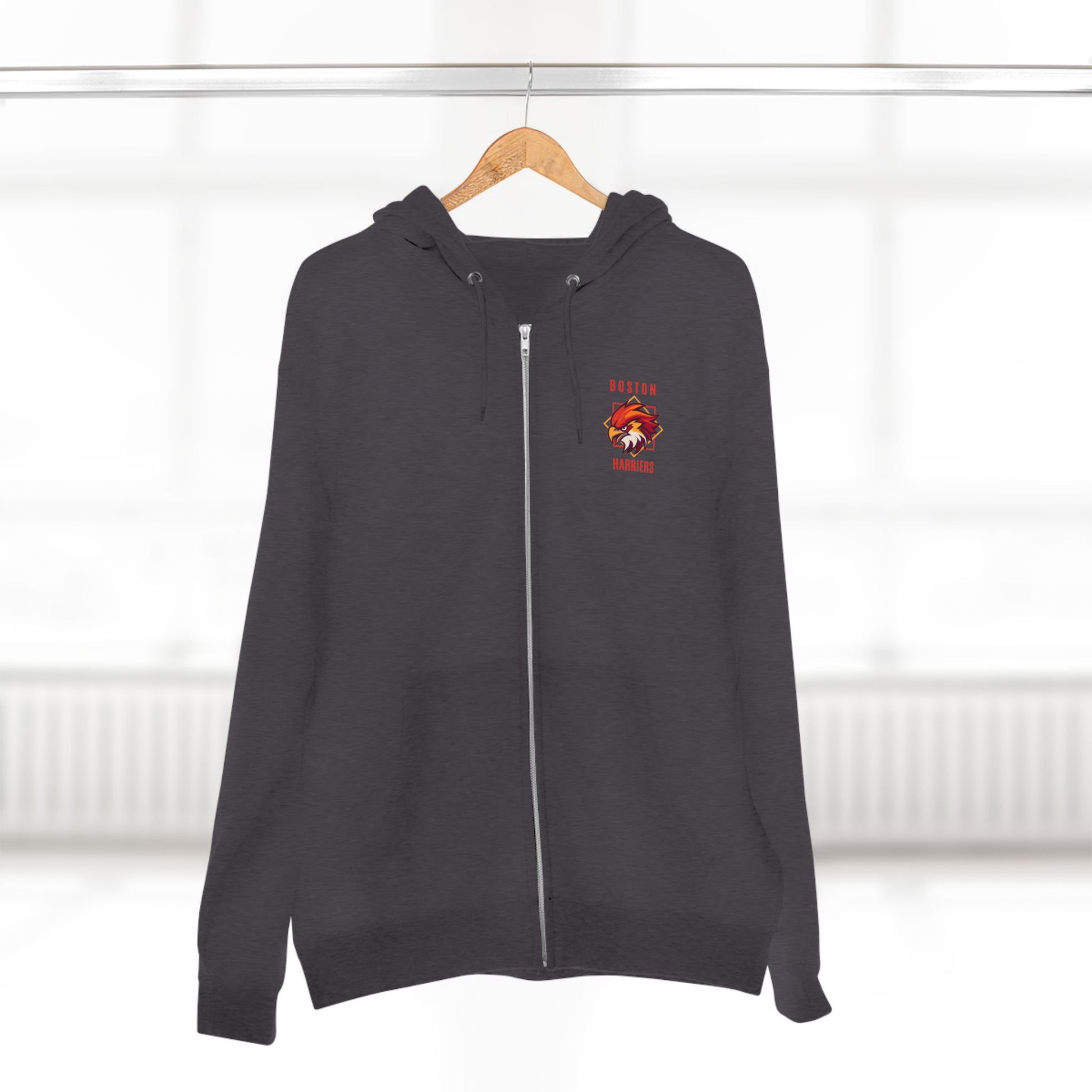 Charcoal heather hoodie with red Boston Harriers logo on front left chest pocket on a hanger against a white background