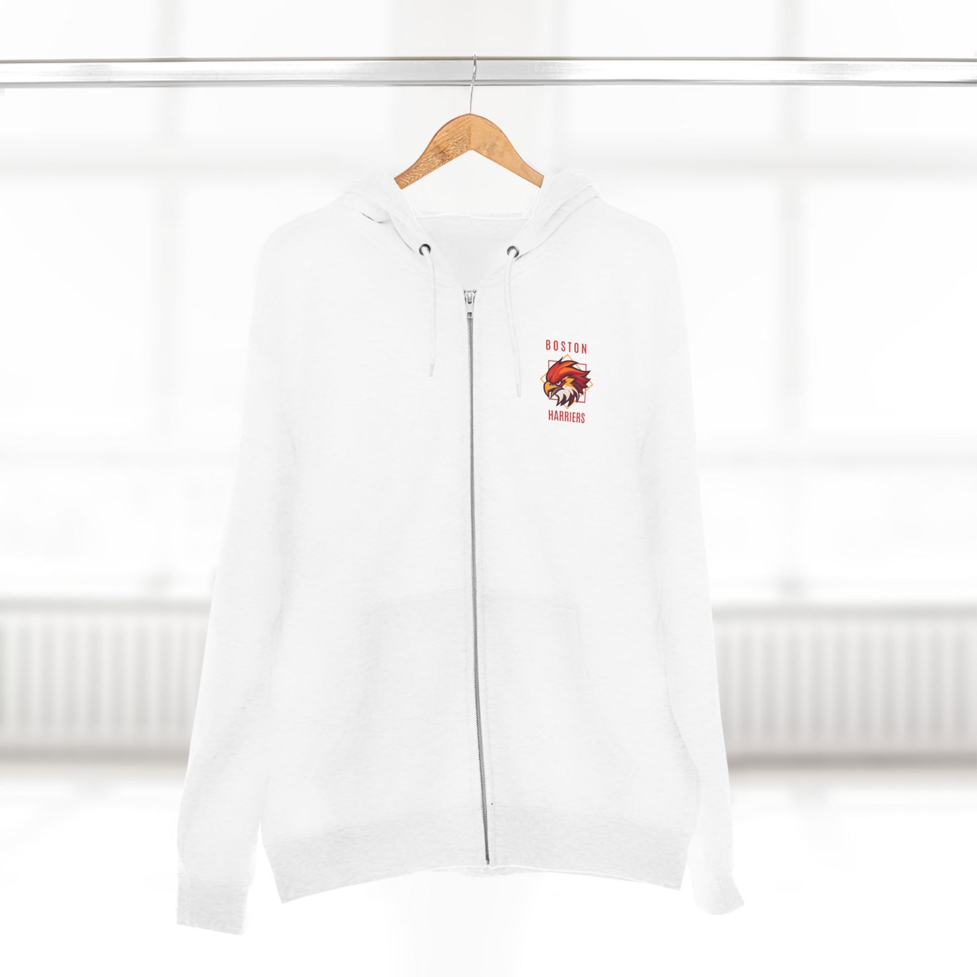 White hoodie with a a red Boston Harriers logo on left chest pocket on a hanger against a white background