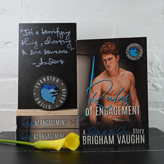 Signed paperback book titled 'Rules of Engagement' by Brigham Vaughn with a yellow flower and a quote from the book.