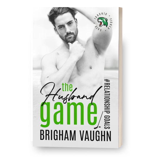 3D mockup of signed paperback The Husband Game by Brigham Vaughn. Shirtless man with dark hair and dark beard 

